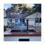 Built in Western style adjustable bbq grill for outdoor live fire cooking