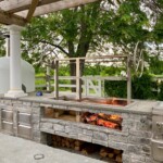 Built in charcoal grill insert with open front for brick island