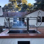 An Argentine grill is the centerpiece of an outdoor kitchen for a serious wood fired cook.