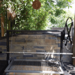 Rotisserie for a charcoal grill insert.