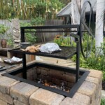 Black iron built in grill frame insert for a brick masonry base.