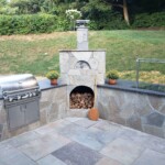 BBQ grill kitchen island with JD Fabrications wood fired grill installed.