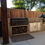 Western style Santa Maria grill with large crank and folding door.