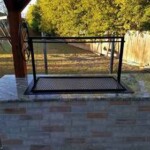 Parrilla style grill with large screen for barbecuing.