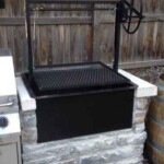 A drop in wood grill with adjustable cooking level.