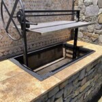 A height adjustable grill for an outdoor kitchen to cook with wood or charcoal.